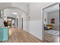 Bright hallway with beautiful wood flooring, neutral walls and inviting decor at 208 S Guthrie Ave, Durham, NC 27703