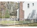 The backyard includes a wooden deck, privacy fence, and a brick chimney at 218 Keith Hills Rd, Lillington, NC 27546