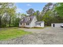 Charming home featuring dormer windows, wood siding, and a gravel driveway at 2603 Brogden Rd, Creedmoor, NC 27522