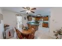 Eat-in kitchen featuring wooden cabinetry, a dining table, and bright natural lighting at 30 Shannon Rd, Timberlake, NC 27583