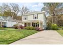 Traditional two-story home with inviting front porch and well-maintained lawn at 303 N Guthrie Ave, Durham, NC 27703