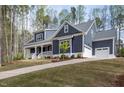Charming home with a manicured lawn and long driveway at 370 Chapel Ridge Dr, Pittsboro, NC 27312