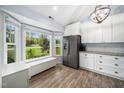 Bright kitchen featuring stainless steel appliances, granite countertops, and a charming breakfast nook with abundant natural light at 3708 Turnbull Ct, Raleigh, NC 27616