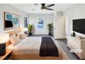 Inviting bedroom featuring a ceiling fan, large window, and stylish decor at 5005 Baywood Forest Dr, Knightdale, NC 27545