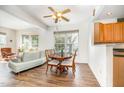 Bright and airy living room featuring hardwood floors, a cozy dining area, and modern decor at 5551 Vista View Ct, Raleigh, NC 27612