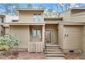 Charming home featuring a multi-level entrance, a combination of siding and brick, and mature landscaping at 58 Stoneridge Rd, Durham, NC 27705