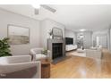 Inviting living room with fireplace, wood floors, stylish furniture and decor, offers a warm and relaxing atmosphere at 58 Stoneridge Rd, Durham, NC 27705