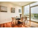 Elegant dining area featuring a marble table, stylish chairs, and a large window at 601 W Rosemary St # 418, Chapel Hill, NC 27516