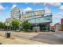 Modern building exterior with glass facade, street view, and attractive landscaping at 601 W Rosemary St # 418, Chapel Hill, NC 27516