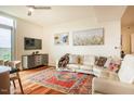 Comfortable living room featuring hardwood floors, a stylish rug, and a plush white sofa at 601 W Rosemary St # 418, Chapel Hill, NC 27516