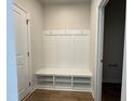 Entryway with convenient storage bench, hooks, and cubbies to keep organized at 609 Callan View Ave, Wake Forest, NC 27587