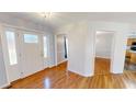 Inviting foyer with hardwood floors, a decorative glass front door, and access to multiple rooms at 772 Old Allensville, Roxboro, NC 27574