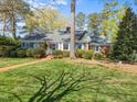 Charming brick home with blue shutters, well-manicured lawn, and a welcoming brick walkway at 806 S First St, Smithfield, NC 27577