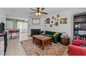 Comfortable living room features a fireplace, ceiling fan and lots of decorations at 103 Friar Ln, Carrboro, NC 27510