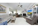 Cozy living room featuring a fireplace, plush seating, ceiling fan and open floor plan at 127 Hurricane Aly, Benson, NC 27504
