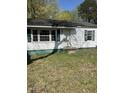 Charming single-story home with vinyl siding and a dark roof at 141 N Bullock St, Henderson, NC 27536