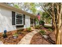 Attractive home exterior with a brick foundation and thoughtfully designed landscaping at 2400 Perennial St, Raleigh, NC 27603