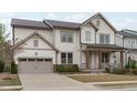 Charming two-story home with a covered front porch and an attached two-car garage at 288 Whispering Wind Dr, Chapel Hill, NC 27516