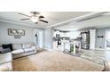 Open-concept living room and kitchen with stainless steel appliances and a cozy sectional sofa at 3014 Split Wood Ct, Oxford, NC 27565