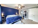 Main bedroom featuring a ceiling fan, neutral carpet, and a connecting bathroom at 3014 Split Wood Ct, Oxford, NC 27565