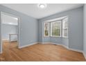 Open dining room with bay window and hardwood floors at 302 Rushingwater Dr, Cary, NC 27513