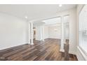 Bright, open-concept living room featuring elegant columns and hardwood floors at 3348 Table Mountain Pine Dr, Raleigh, NC 27616