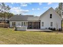 Large backyard with a wooden deck and covered porch, perfect for outdoor entertaining at 381 Heart Pine Dr, Wendell, NC 27591