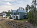 Charming two-story home with a manicured lawn and attractive landscaping details at 3908 Sage Ct, Wake Forest, NC 27587