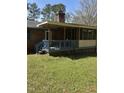 Cozy screened-in back porch with wooden railings and stairs leading to the yard at 4001 W Antioch Dr, Oxford, NC 27565