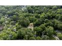 New construction nestled among mature trees in a residential neighborhood at 5205 Quail Meadows Dr, Raleigh, NC 27609