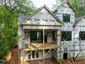 New home construction with wood deck and sliding glass doors to backyard at 5205 Quail Meadows Dr, Raleigh, NC 27609