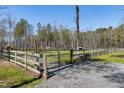 Gated fence enclosing the property, ensuring privacy and security for the farmhouse at 6480 Beaver Creek Rd, New Hill, NC 27562