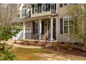 Charming front exterior view of the home, featuring a two-car garage and well-maintained landscaping at 765 Carlton St, Clayton, NC 27520
