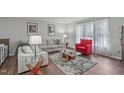 Inviting living room with hardwood floors, neutral tones, and comfortable seating arrangements at 900 Stoneybrook Dr, Sanford, NC 27330