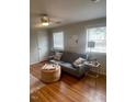 Cozy living room with bright windows and hardwood floors at 907 St Marys St, Raleigh, NC 27605