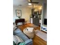 Comfortable living room with hardwood floors open to a modern kitchen at 907 St Marys St, Raleigh, NC 27605