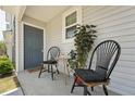 Cozy front porch with seating area and decor at 918 E Green St # A102, Franklinton, NC 27525