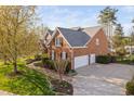 Spacious home with a three-car garage and meticulously landscaped grounds at 9320 Teton Pines Way, Raleigh, NC 27617