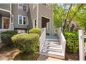 Condo exterior showing white stairway and greenery at 101 Hunting Chase # 2B, Cary, NC 27513