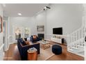 Decorated living room with vaulted ceiling, fireplace, sofa, chairs, and entertainment center at 1426 Quarter Pt, Raleigh, NC 27615