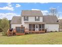 The backyard features a deck with built-in grill and space for entertaining at 15 Longwood Dr, Youngsville, NC 27596