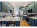 Bright eat-in kitchen with stainless steel appliances and shaker style cabinets at 15 Longwood Dr, Youngsville, NC 27596