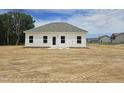 A new house with a large, unfinished backyard at 21 Mildred Pl, Broadway, NC 27505