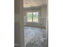 Bright bedroom featuring a large window with natural light, ready for personalization and decoration at 21 Mildred Pl, Broadway, NC 27505