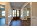 Inviting foyer features wood floors, wainscoting, and a stunning front door at 229 Gilliland Rd, Siler City, NC 27344