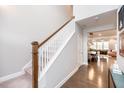 Elegant entryway featuring hardwood floors, staircase, and views into the dining and living areas at 237 Begen St, Morrisville, NC 27560