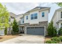 Charming home with a two-car garage, stone accents and manicured landscaping at 237 Begen St, Morrisville, NC 27560