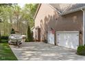 Spacious two-car garage with an adjacent boat parking area at 2909 Timpani Trl, Apex, NC 27539