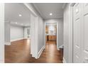 Spacious living room showcasing hardwood floors and neutral paint at 2949 Tram Rd, Fuquay Varina, NC 27526