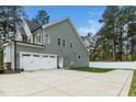 Spacious two-car garage with an extended driveway and well-kept backyard at 321 Third Ave, Knightdale, NC 27545